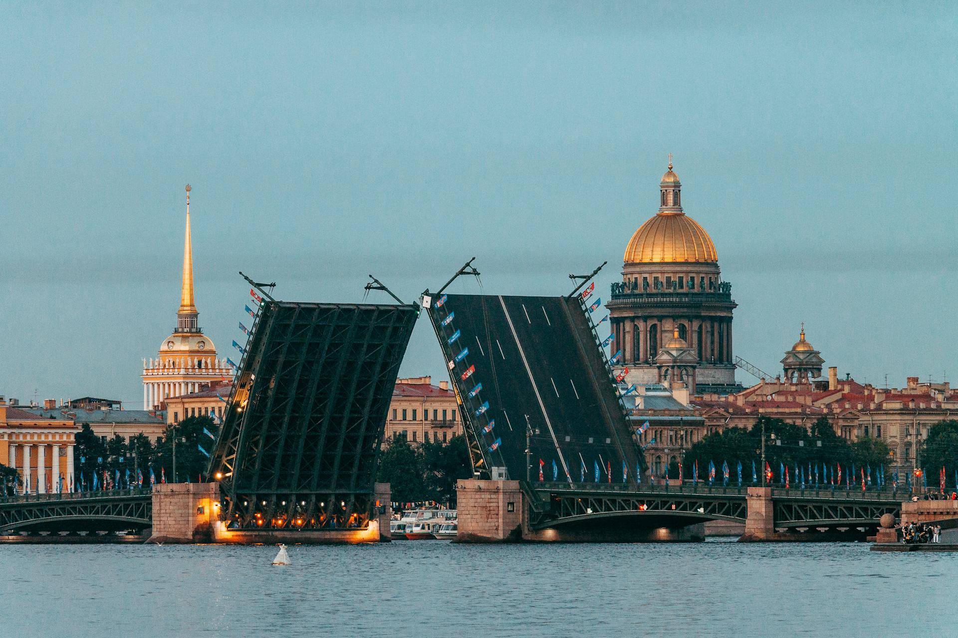 View of Saint Petersburg: drawbridge in the foreground, Admiralty building and St Isaac's Cathedral dome behind
